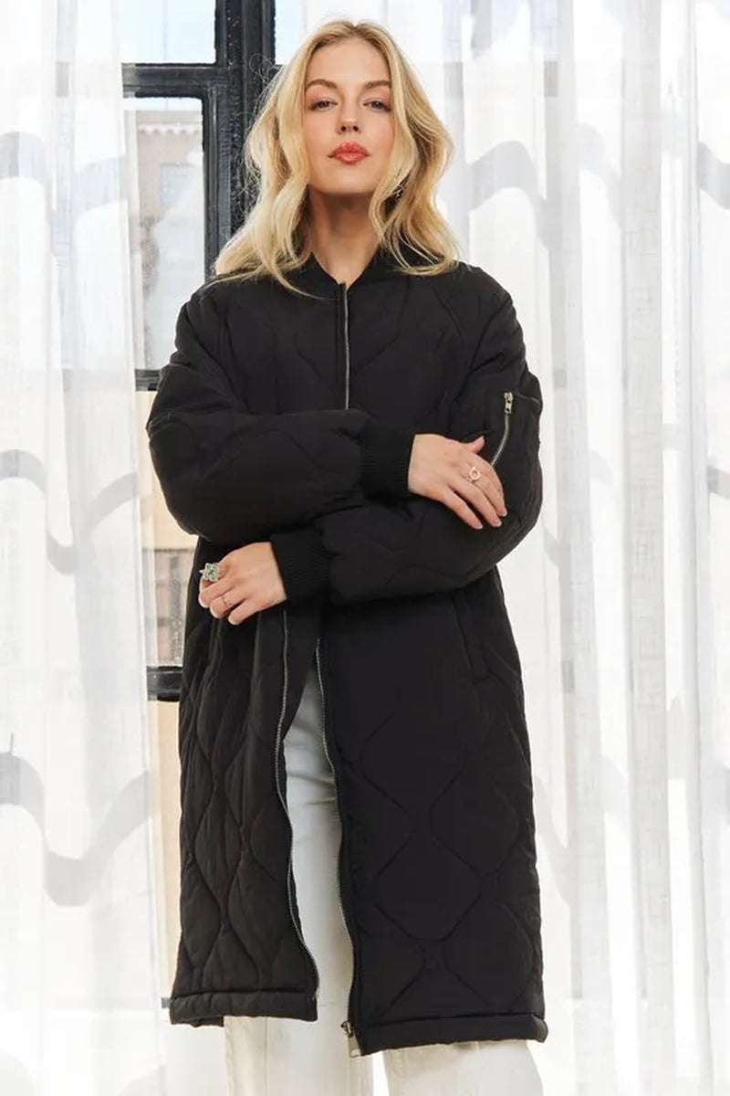 Women’s zip-up utility long jacket in black, featuring quilted design and stylish long silhouette.