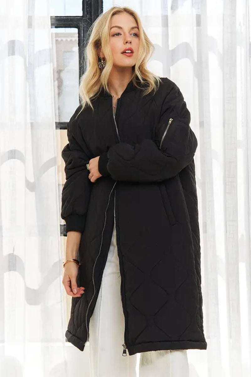 Women's zip-up utility long jacket in black with quilted design, featuring pockets and a stylish silhouette.