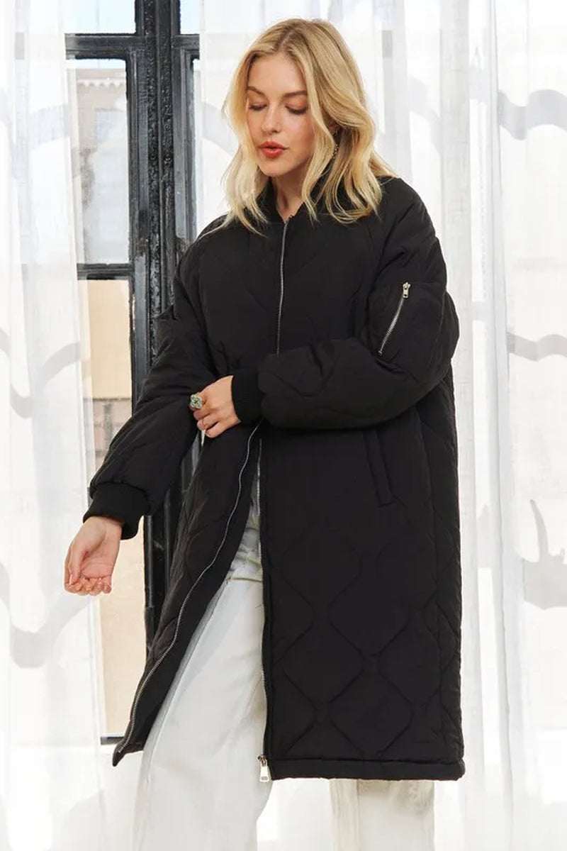 Stylish woman wearing a black zip-up utility long jacket, showcasing its modern design and functional pockets.