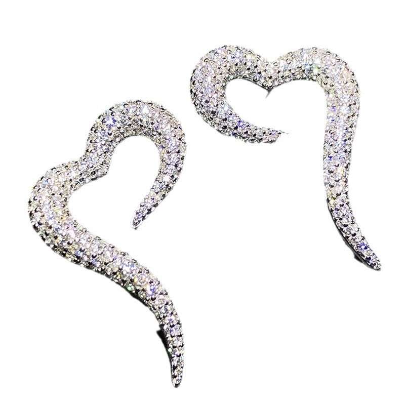 Heart-shaped zircon stud earrings for women in white gold finish