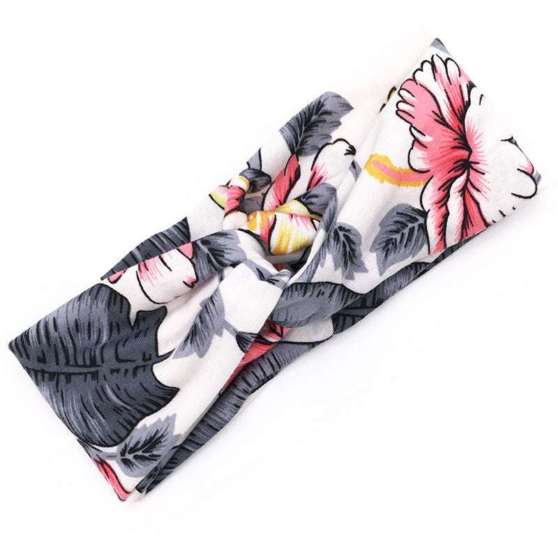 Boho Chic Floral Cross Headband fabric bow with pink and grey floral print on white background