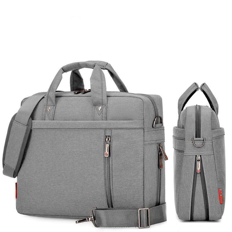Waterproof Oxford cloth laptop bag in gray with multiple compartments and adjustable strap.