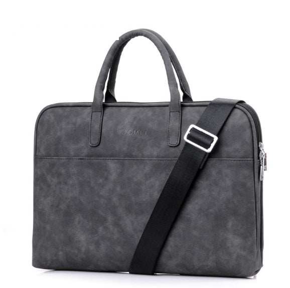 Faux leather laptop bag for women in grey with dual handles and adjustable strap.