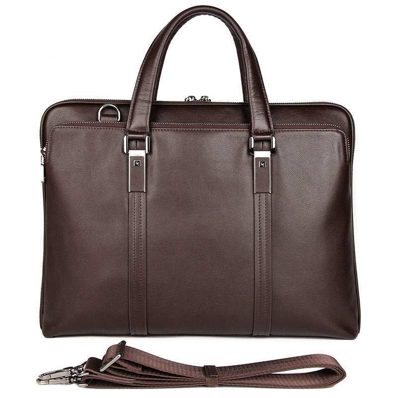 Leather business briefcase in dark brown with two handles and detachable shoulder strap.