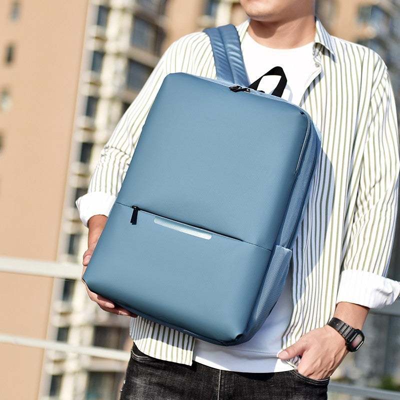 Large-capacity business laptop backpack in light blue, perfect for daily use and travel.