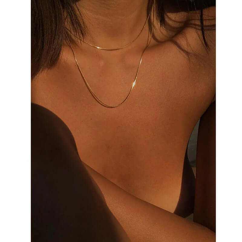 18K gold plated double-row snake chain necklace worn by a model, showcasing elegance and style.