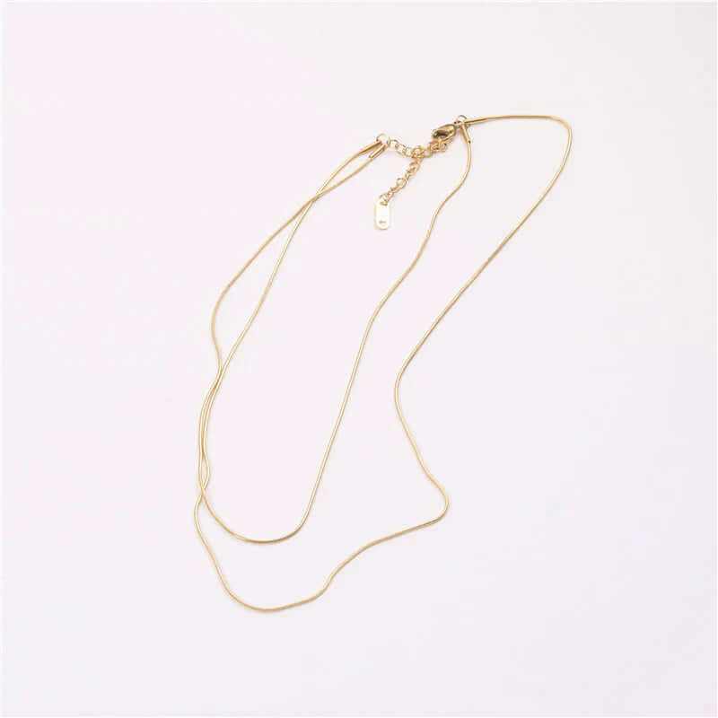 18K gold plated double-row snake chain necklace displayed elegantly on a light background.