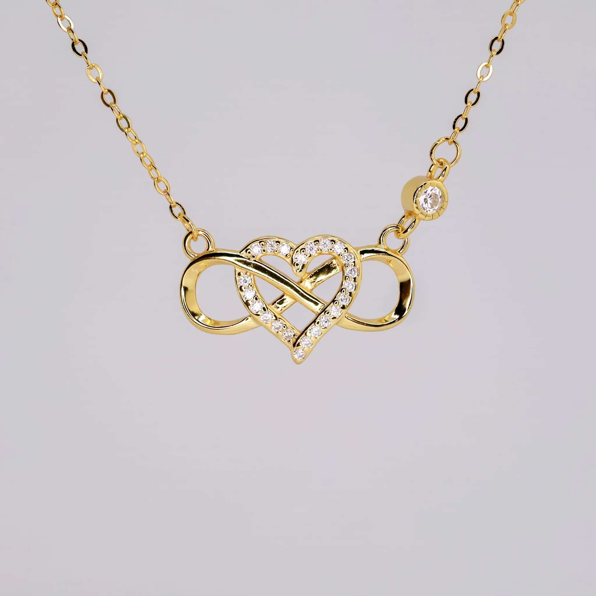 18K gold plated micro pave heart infinity pendant necklace with sparkling cubic zirconia accents on a delicate chain.