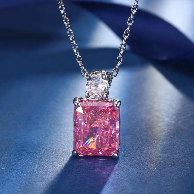 Stunning 18K gold plated necklace featuring a pink diamond and lab-imitation white diamond on a sterling silver chain.
