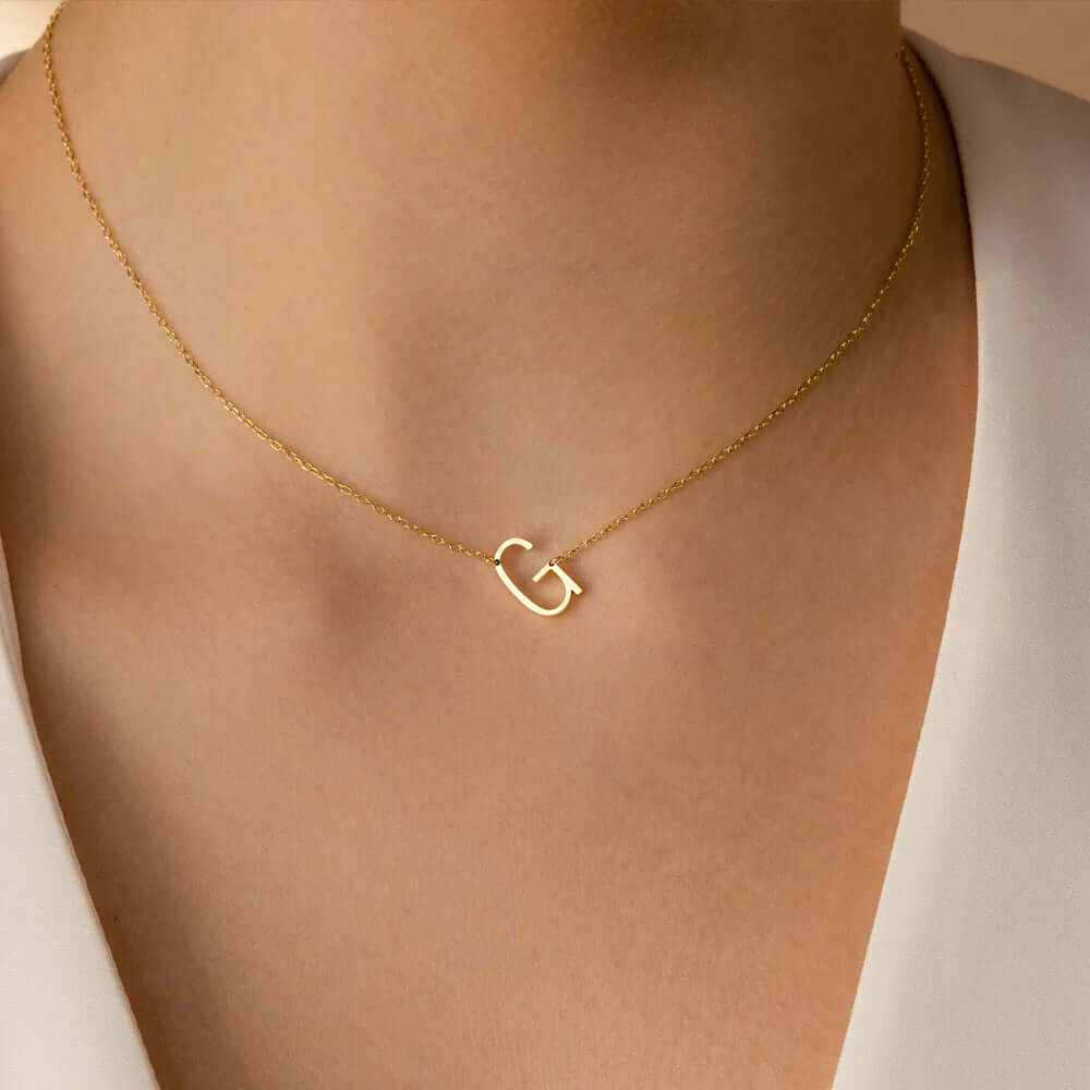 18k gold plated sideways initial letter necklace showcasing a personalized 'G' pendant on a delicate chain.
