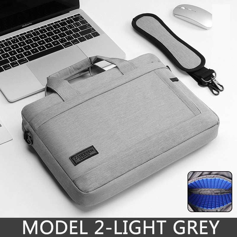 15.6 inch laptop bag in light grey with handles, next to a laptop and mouse, showcasing multi-use design.