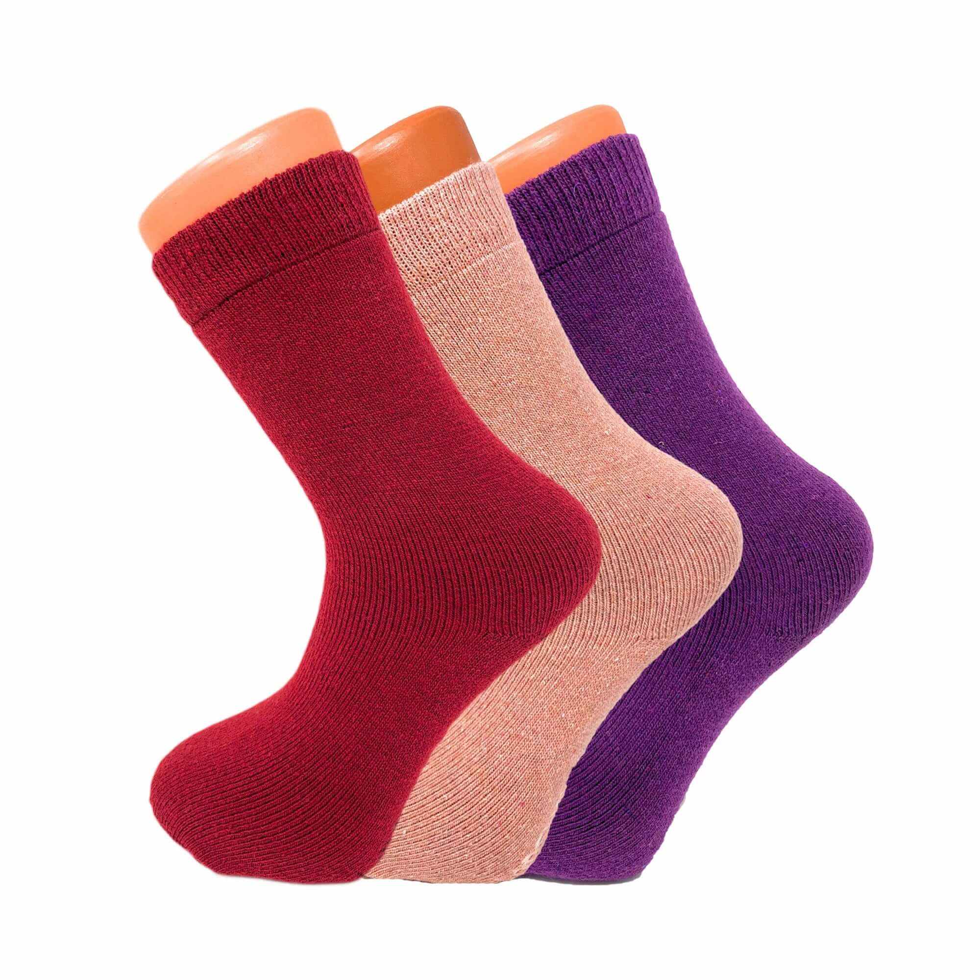 3 pairs of women's thermal wool socks in red, peach, and purple for cozy winter warmth