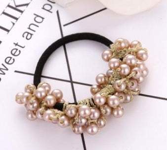 Beaded hair rope with pink pearls and cloth band on white background