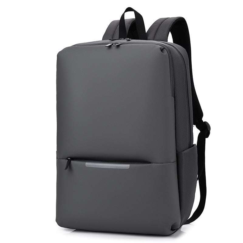Large-capacity business laptop backpack in sleek gray design with zipper closure and spacious compartments.