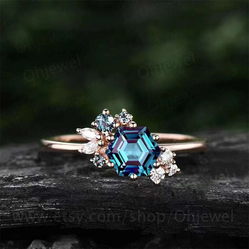 Prismatic Brilliance Six-Claw Zircon Ring with blue geometric center stone and gold band for women