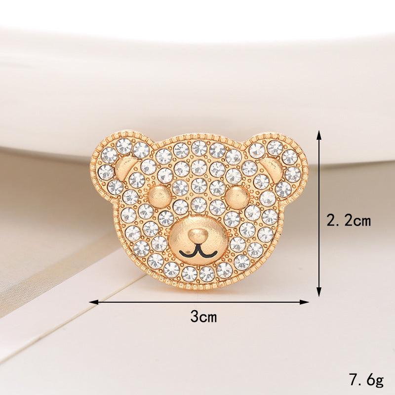 Sparkling gold bear brooch adorned with rhinestones, measuring 3cm x 2.2cm, perfect for adding charm to your outfit.