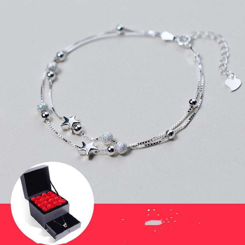 Delicate silver star and bead bracelet in luxury gift box with red roses, perfect birthday gift for girls