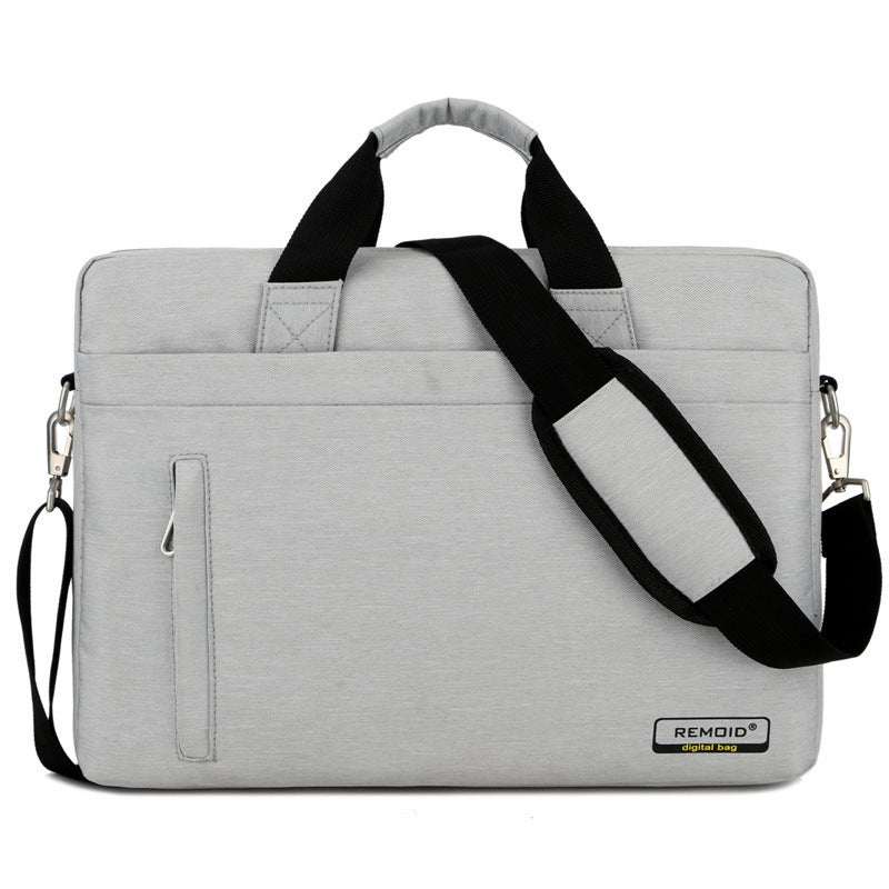 waterproof shoulder bag for laptops in gray nylon material with adjustable strap and multiple pockets.