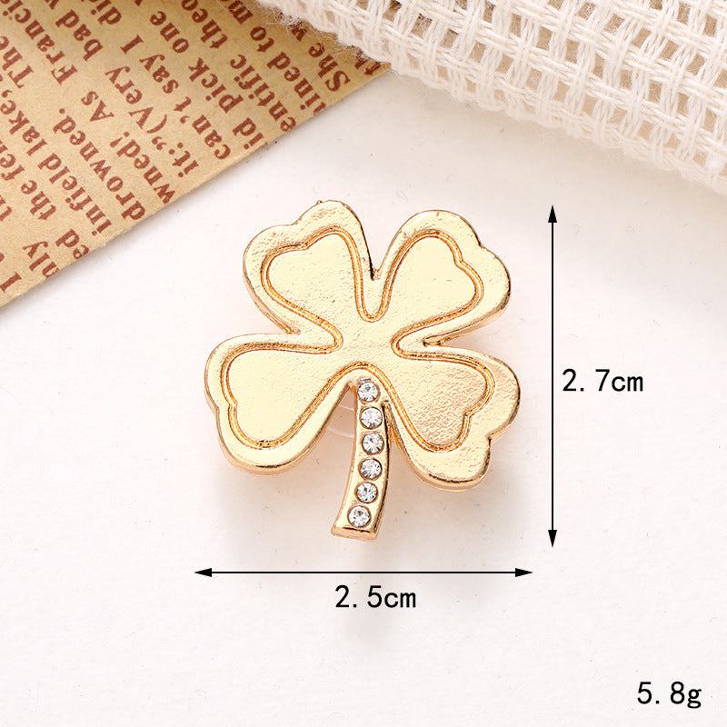 Gold four-leaf clover shoe ornament with crystal detailing, measuring 2.7cm x 2.5cm, perfect for stylish footwear enhancement.