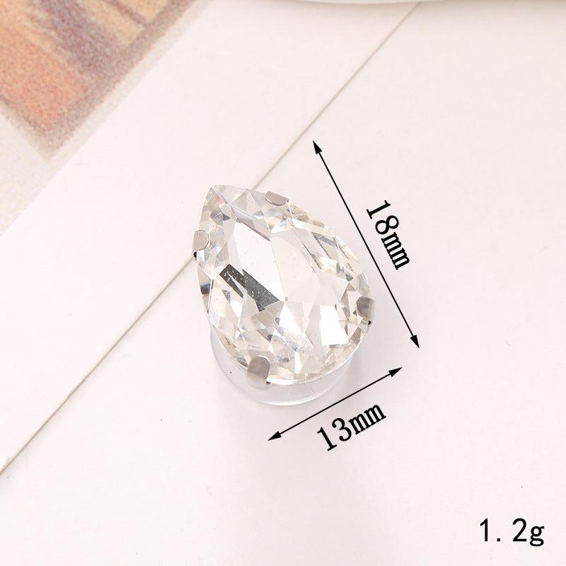 Clear crystal teardrop decoration, measuring 18mm by 13mm, perfect for shoe ornaments or embellishments.