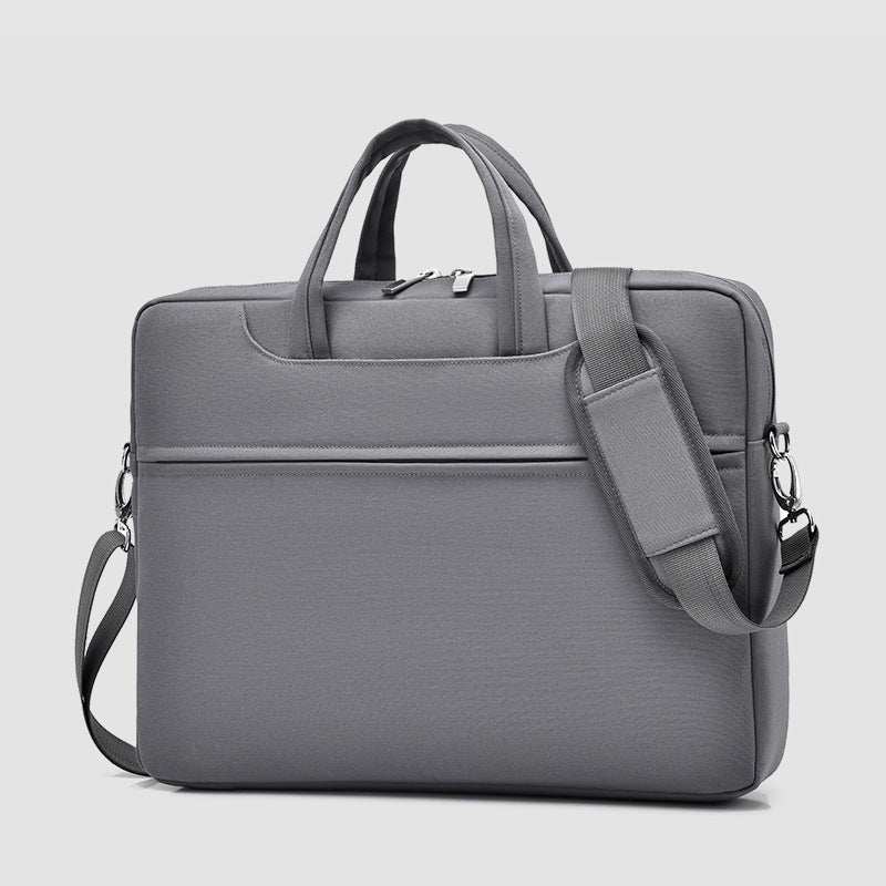 Large capacity laptop bag for men in gray with dual handles and adjustable shoulder strap.
