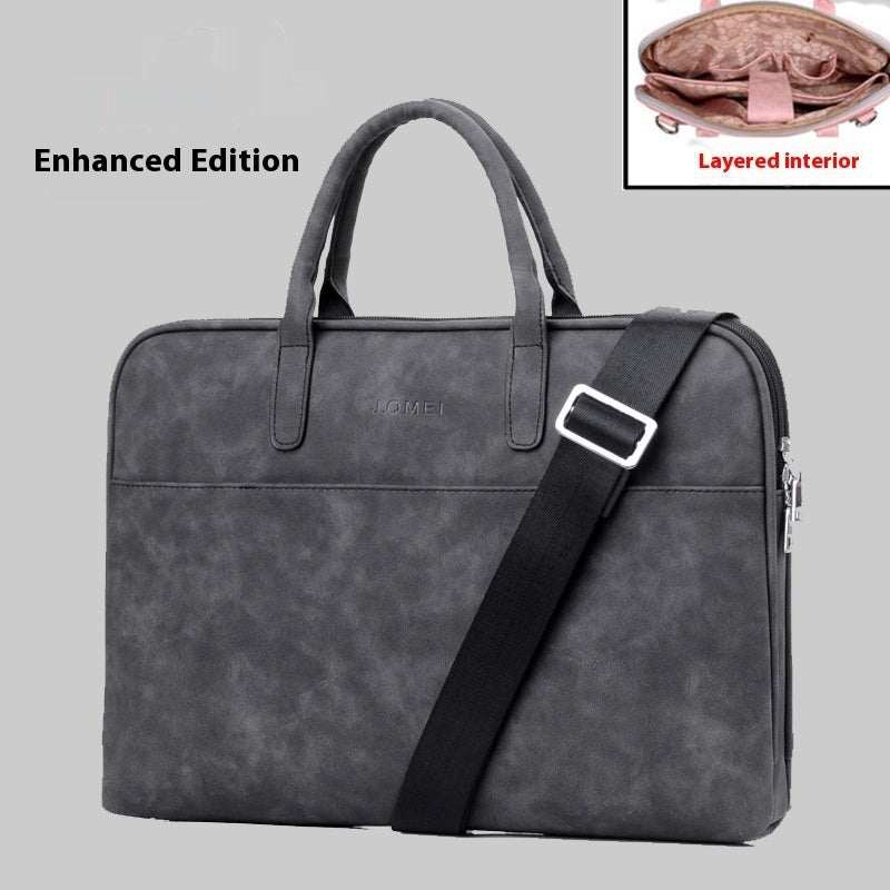 Faux leather laptop bag for women with shoulder strap and zipper closure, featuring a layered interior.