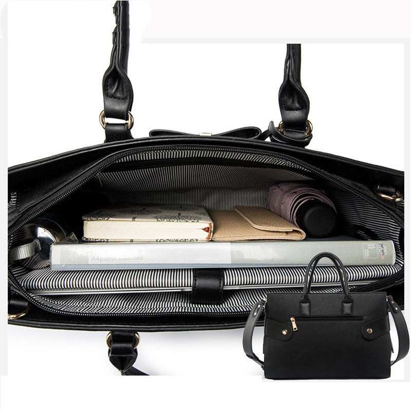Interior view of a fashionable computer bag for women, showcasing organized compartments with books and documents.