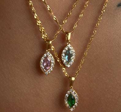 Durable Titanium Steel Zircon Necklace featuring pink, green, and blue zircon pendants on gold chains.