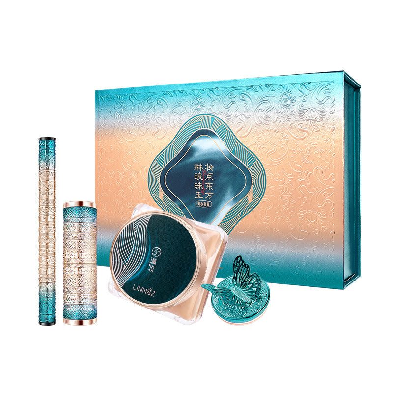 Air Cushion & Lipstick makeup kit with cream cushion, eyeliner, lipstick, and powder puff in teal and gold packaging