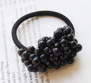 Black beaded hair rope made of cloth with clustered bead design