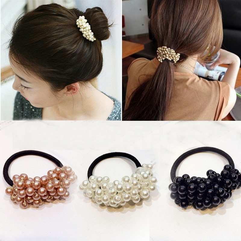 Beaded hair rope with pearl-like beads in black, white, and rose gold colors on elastic bands for stylish hair ties