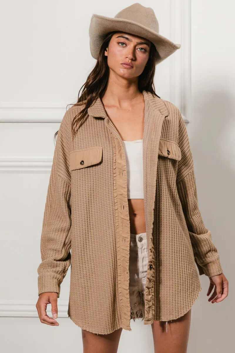 Bibi Heavy Waffle Oversized Shacket in beige, styled with shorts and a hat for a chic, casual look.