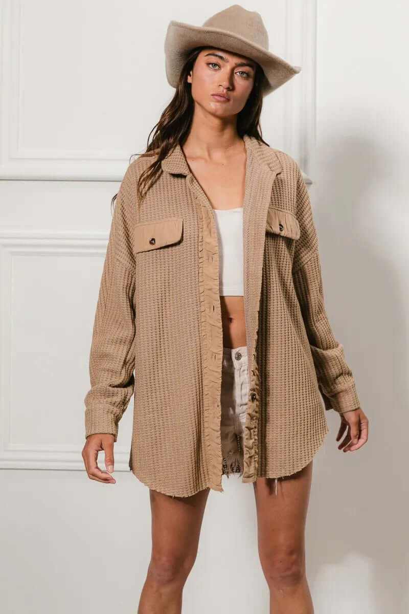 Bibi heavy waffle oversized shacket in beige, styled with shorts and a hat for a chic, casual look.