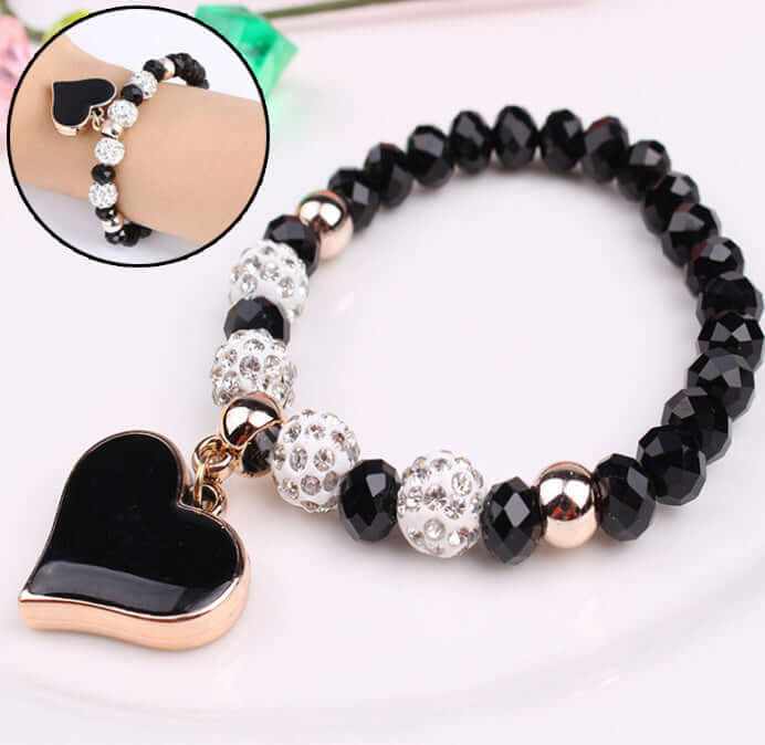 Elegant black heart crystal bracelet with sparkling beads, perfect for adding a touch of style and sophistication.