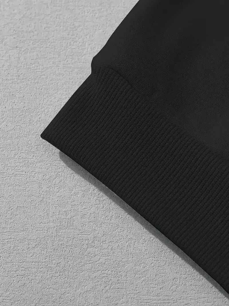 Close-up of black polyester spandex hoodie cuff showing fabric texture and stitching detail