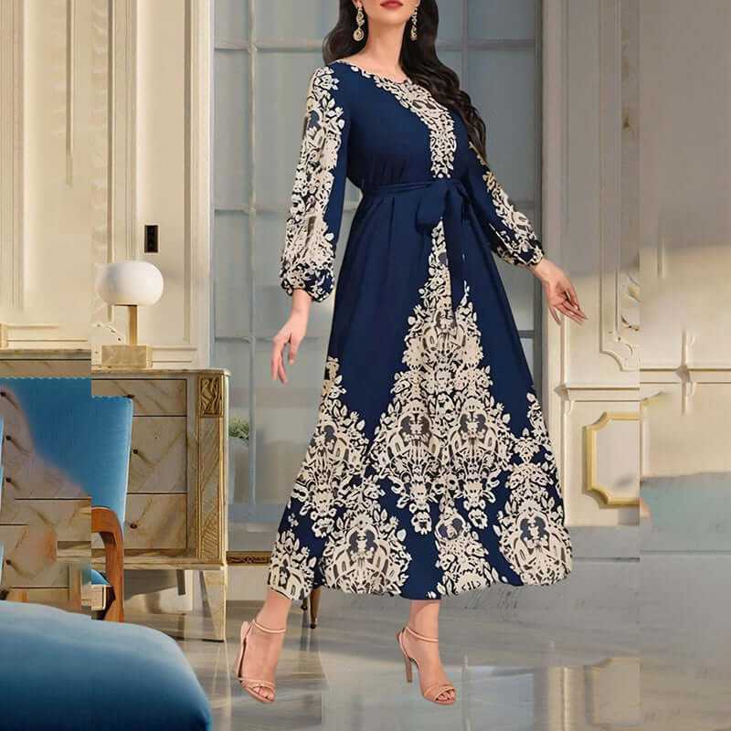 Women's bohemian floral print maxi dress with long sleeves and drawstring waist in navy blue and cream.