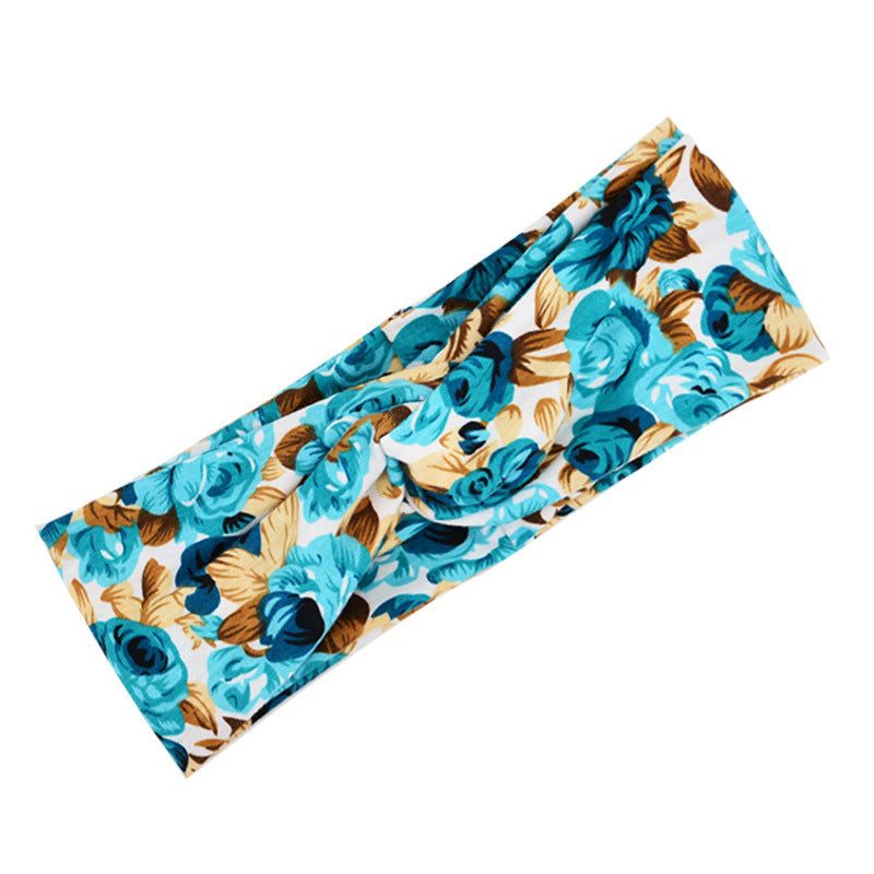 Boho Chic Floral Cross Headband with blue and brown floral pattern on fabric material