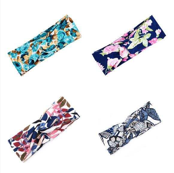 Set of four Boho Chic Floral Cross Headbands in various colorful floral patterns and fabric material.