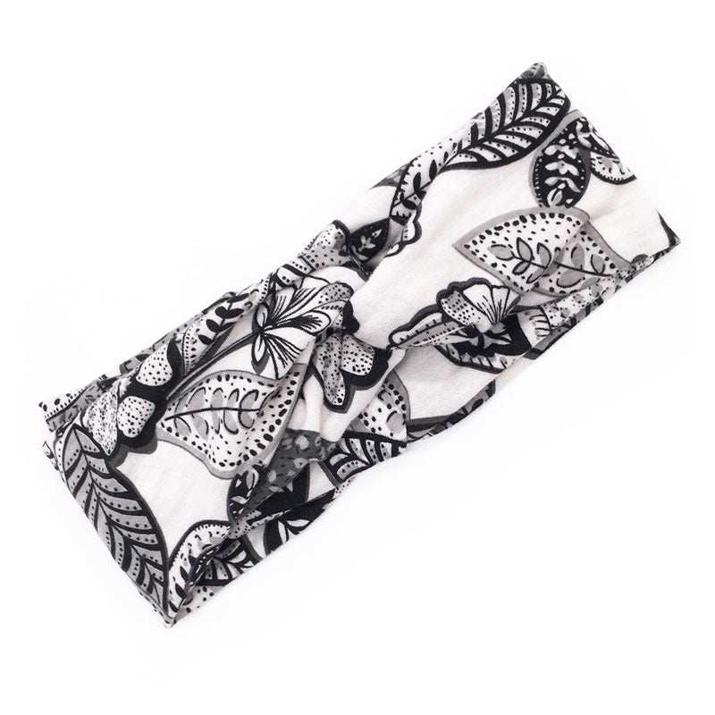 Boho chic floral cross fabric headband in black and white pattern