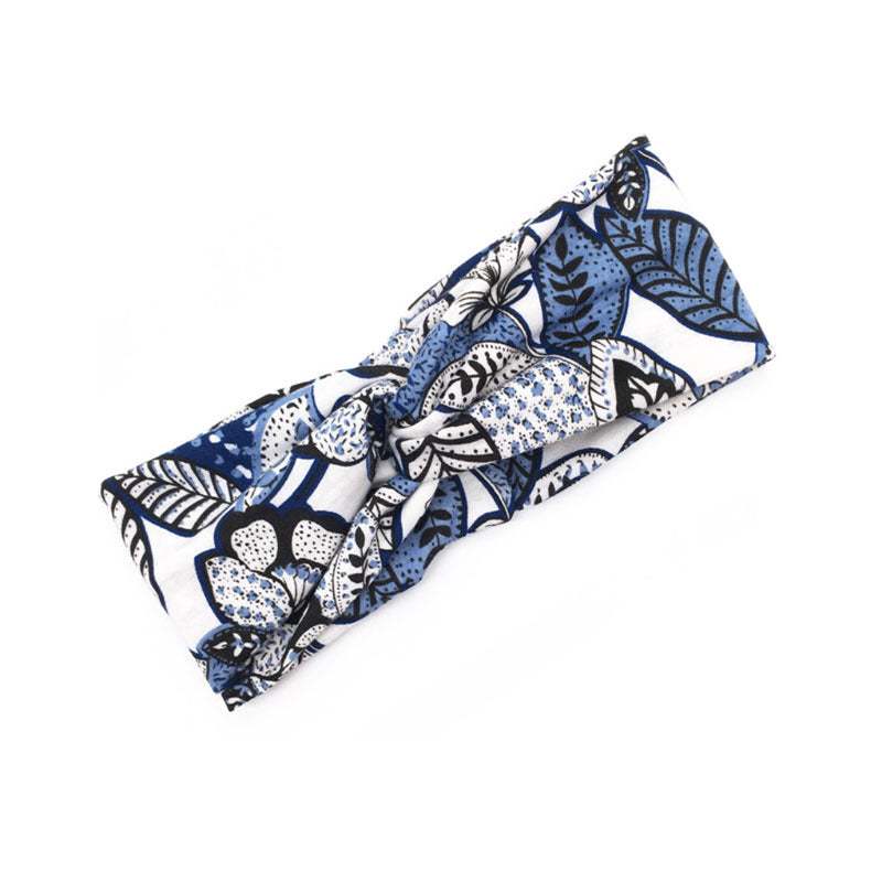Boho Chic Floral Cross Headband with blue and white floral pattern and fabric bow design