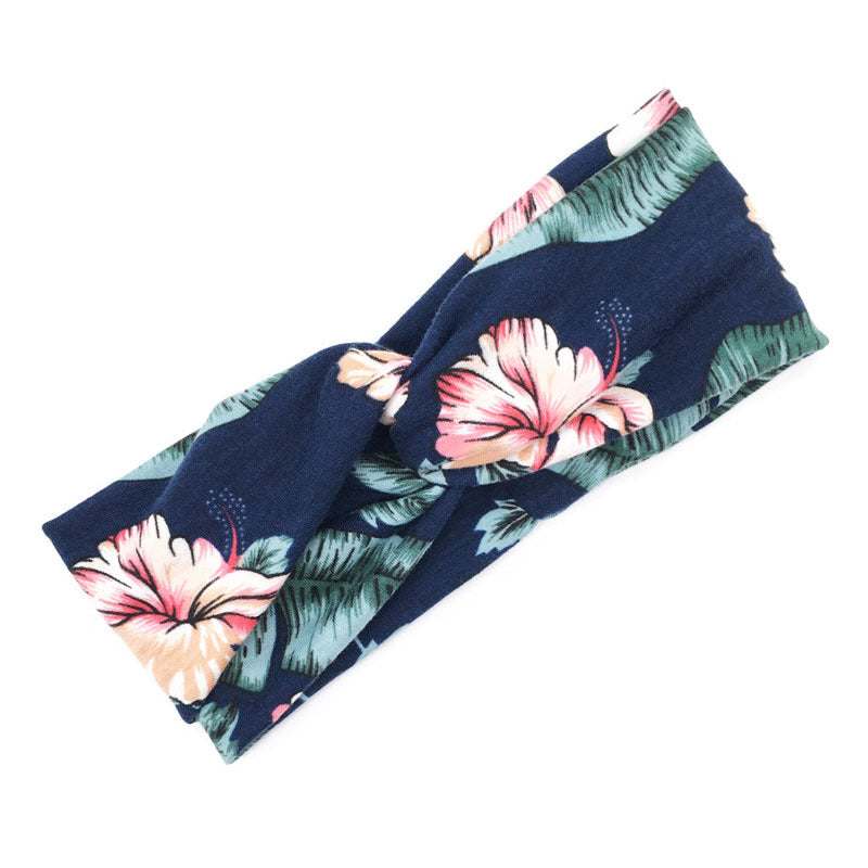 Boho chic floral cross fabric headband with navy blue and pink flower pattern