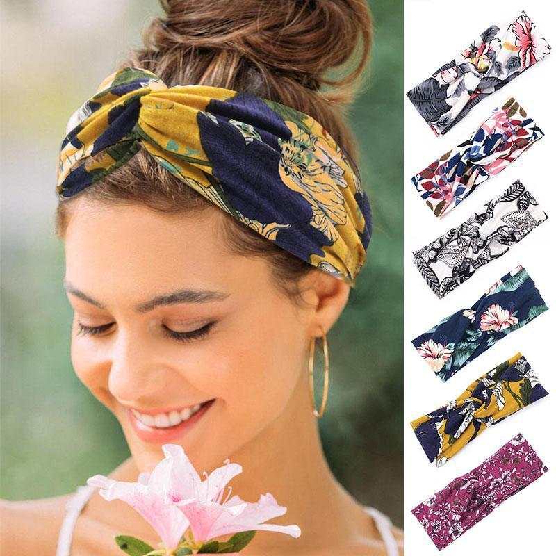 Boho Chic Floral Cross Headband worn by woman with floral patterns in multiple colors including yellow, navy, and pink