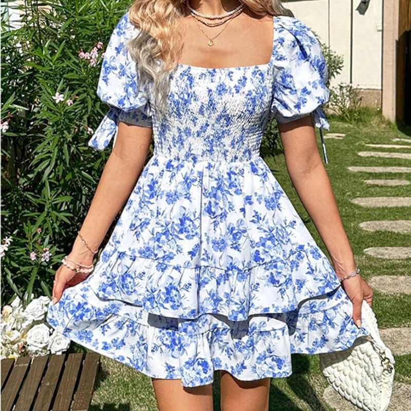 Women's puff sleeve floral print mini dress with square neck and ruffle hem, perfect for summer outfits.