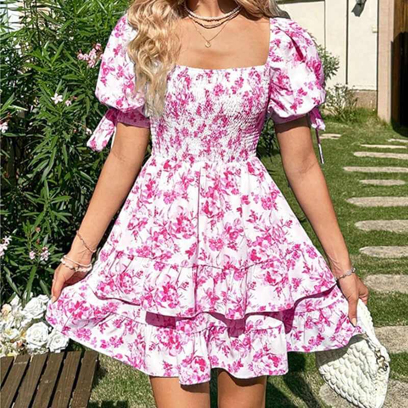 Women's boho puff sleeve mini dress with floral print and ruffle hem, perfect for summer outings.