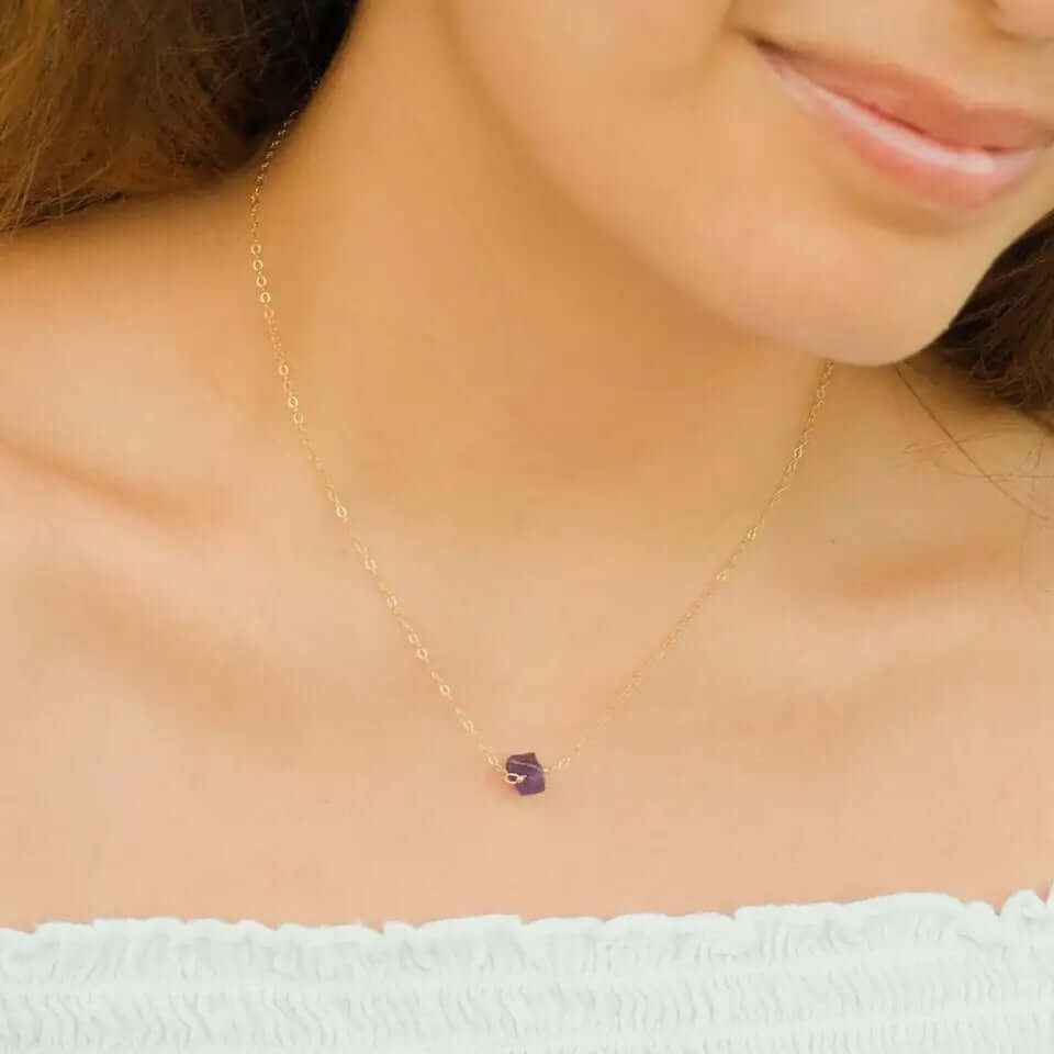 Boho natural elemental stone charm pendant necklace on a model, showcasing geometric elegance and sophistication.
