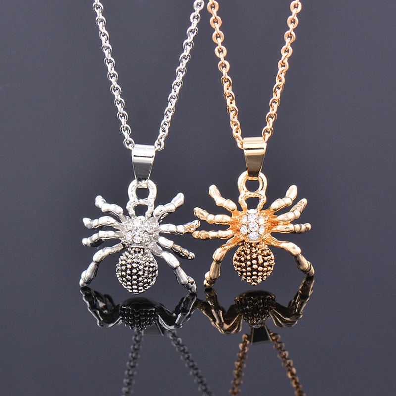 Bold statement gothic spider pendant necklace in silver and gold with rhinestone details