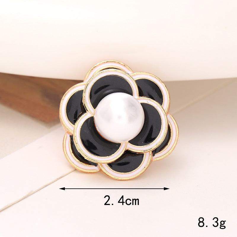 Bright Pearl Flower Shoe Ornament with black petals and pearl center, perfect for elevating any footwear style.