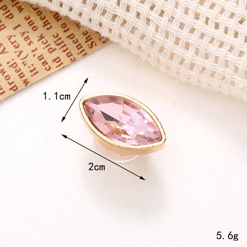 Bright pearl flower shoe ornament featuring a pink crystal in gold setting, measuring 2cm x 1.1cm for stylish footwear embellishment.