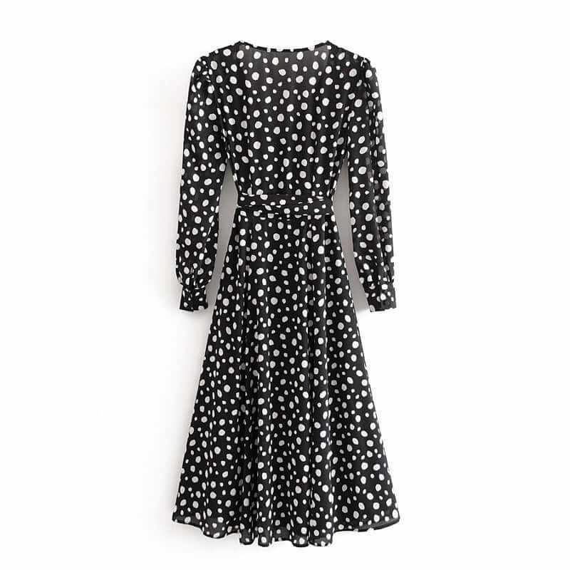 Chiffon split wrap long sleeve dress with polka dots, black and white, styled for a feminine look.