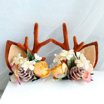 Children's Christmas hair clip with fabric antlers and floral decoration